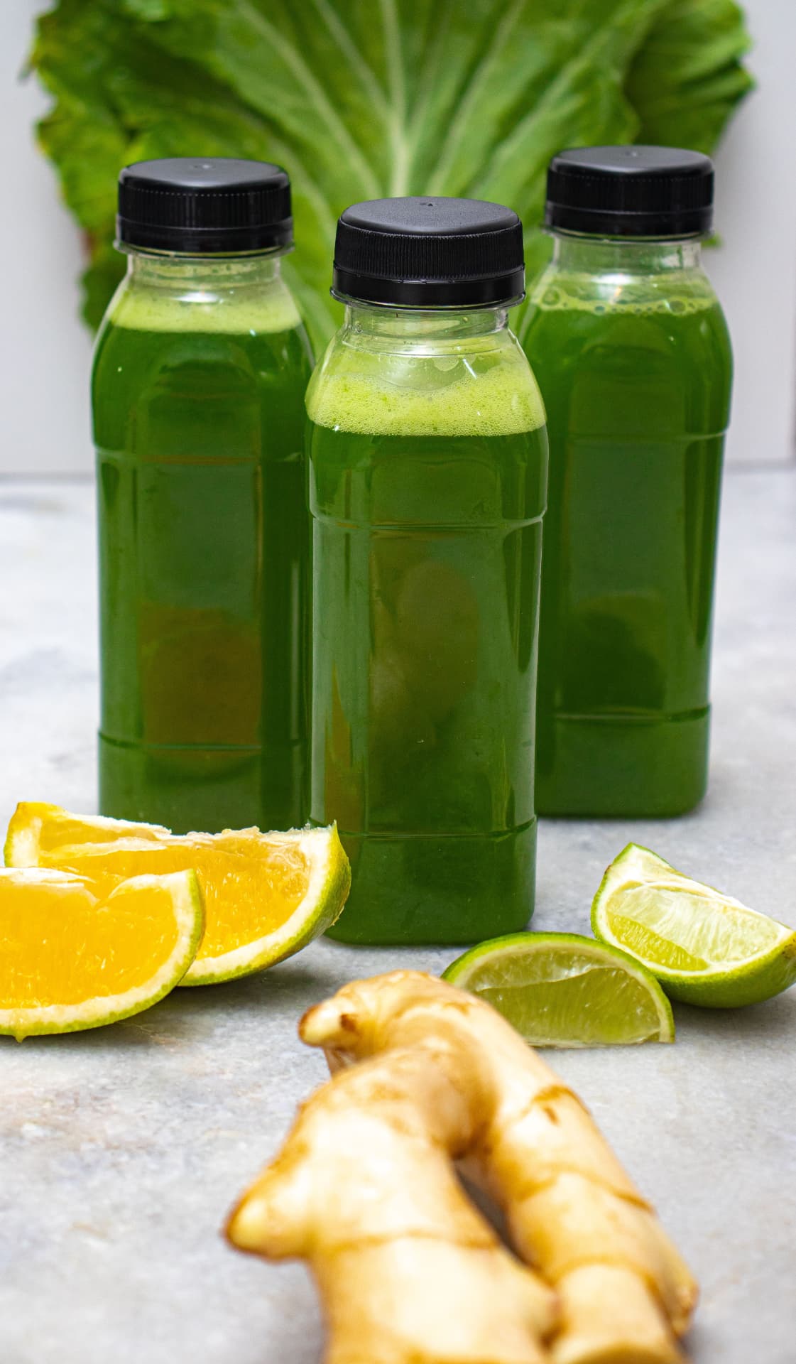 Fresh green vegetable juice with citrus and ginger